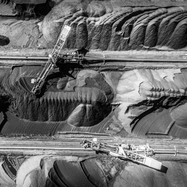 istock Black coal deposits. Exploration and machine. View from above. 683540264