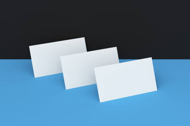 istock White blank business cards mock-up on black and blue background 683544586