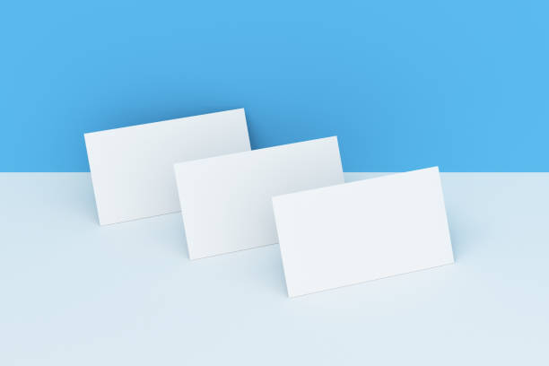 istock White blank business cards mock-up on white and blue background 683544674