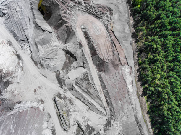 istock Border between industial site and gree forest. Aerial view of open pit sand. 683544752