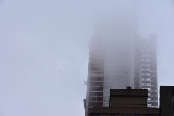 istock Smoke emerges from a tall building 683544952