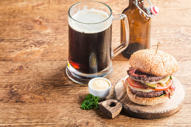 istock Hamburger and dark beer in vintage style 683549034