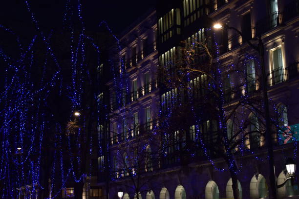 istock Night streets with lit Christmas lights. 683565078