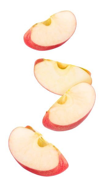 Isolated red apple pieces flying in the air
