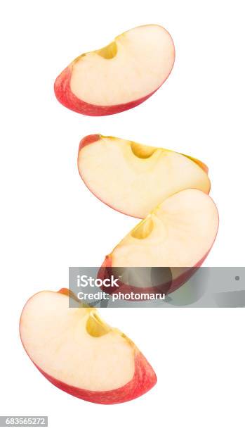 Isolated Red Apple Pieces Flying In The Air Stock Photo - Download Image Now - Apple - Fruit, Slice of Food, Cross Section