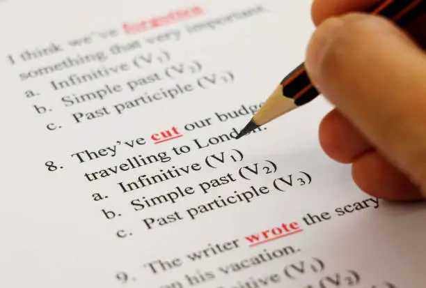 closeup english exam sheet on table with pencil