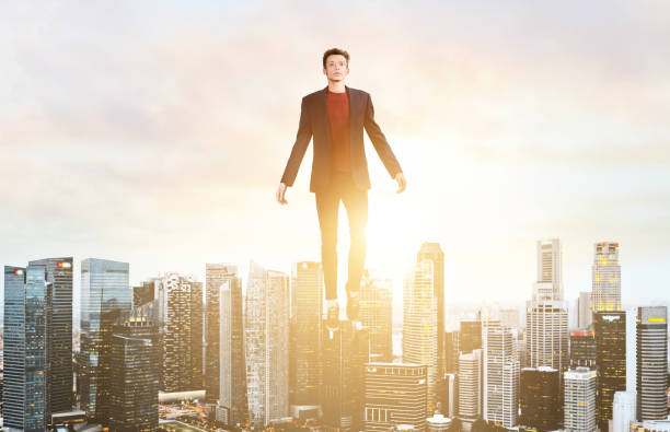 istock Business man hover over city skyline 683575050