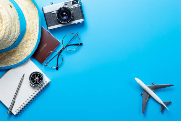 istock travel accessories on Blue background copy space 683576138