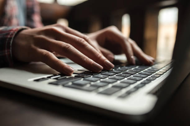 istock Close up of unrecognizable person typing an e-mail on laptop. 683580042