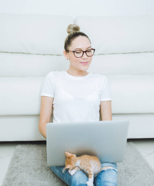istock Woman with cat at home 683580270