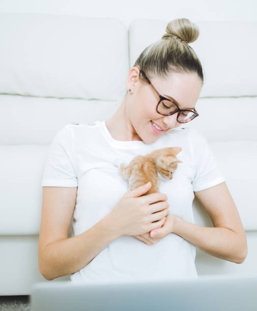 istock Woman with cat at home 683581032