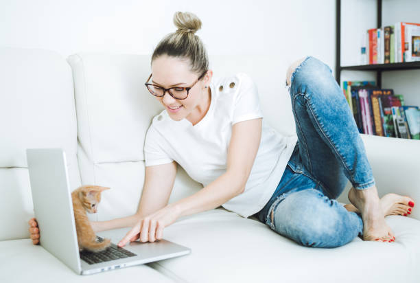 istock Woman with cat at home 683582218
