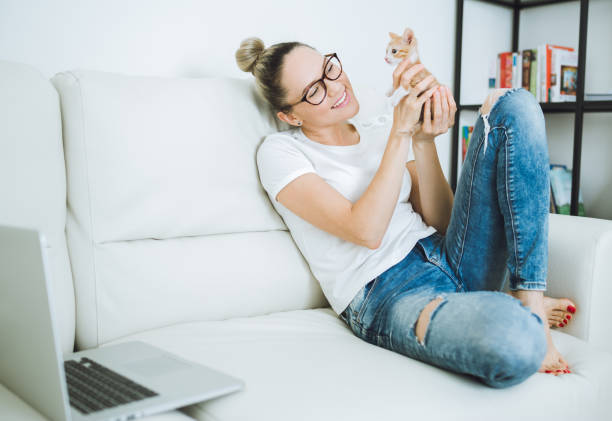 istock Woman with cat at home 683582246