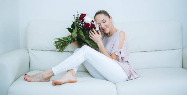 istock Woman holding flowers bouquet 683582376
