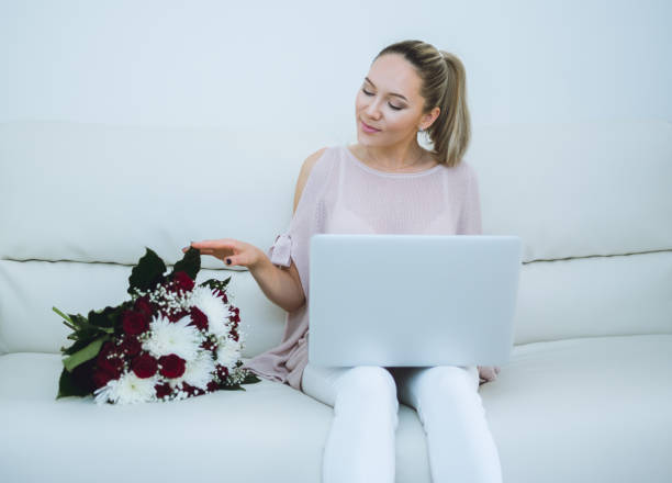 istock Woman holding flowers bouquet 683582402