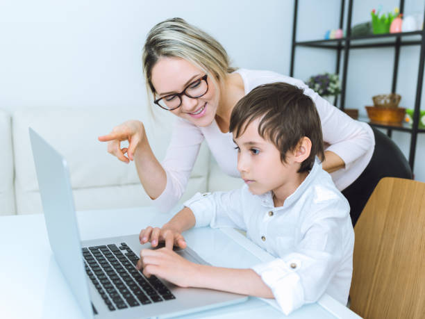 istock Mother and son working with a laptop 683582612