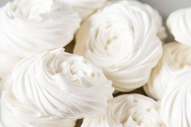 istock Meringue dessert Pavlova cake with fresh berries on a stone background 683586934