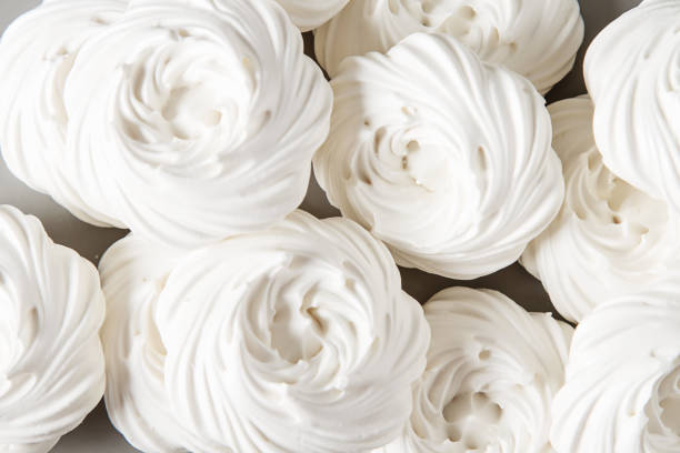 istock Meringue dessert Pavlova cake with fresh berries on a stone background 683586980