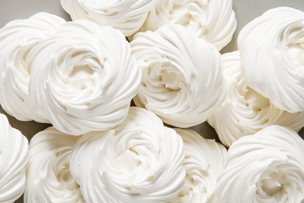 istock Meringue dessert Pavlova cake with fresh berries on a stone background 683586994