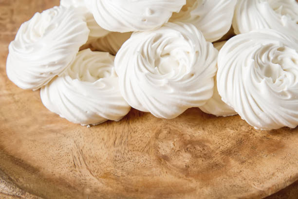 istock Meringue dessert Pavlova cake with fresh berries on a stone background 683587026