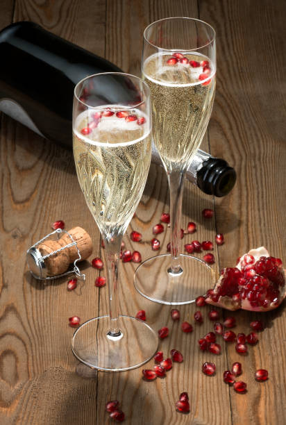 istock Sparkling Champagne flutes with pomegranate seeds 683590322