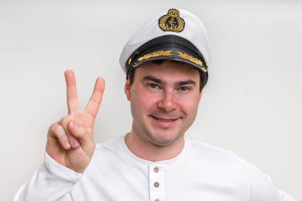 istock Captain with sailor cap showing victory sign 683593554