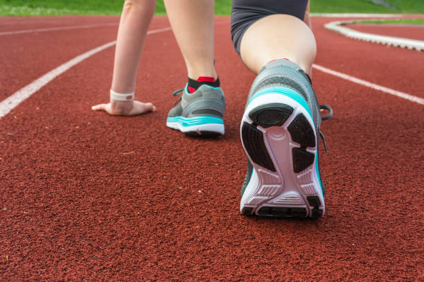 istock Athlete woman at starting line ready to run 683594040