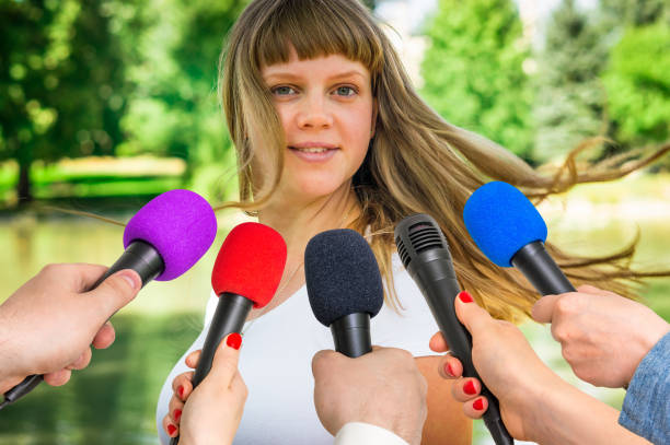 istock Reporters making interview with young woman 683597640
