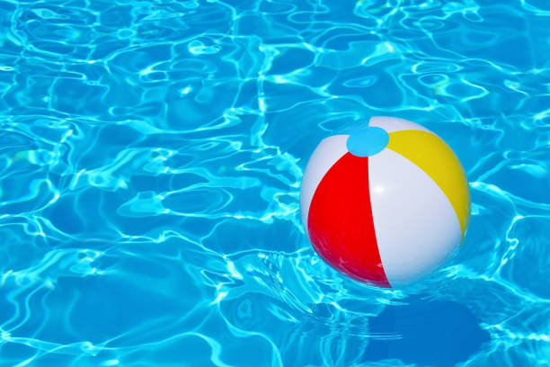 istock Colorful inflatable ball floating in swimming pool 683597666