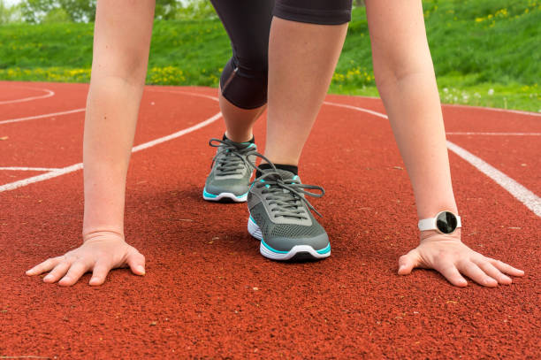 istock Athlete woman at starting line ready to run 683597752