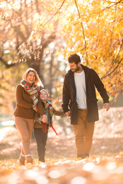 istock Young happy family taking a walk in the park. 683597758