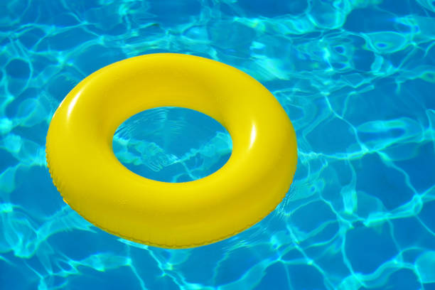 istock Colorful inflatable tube floating in swimming pool 683598230