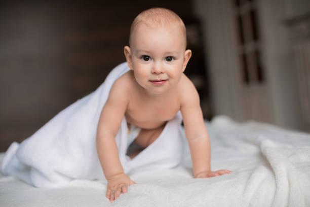 istock baby boy with white towel 683600750