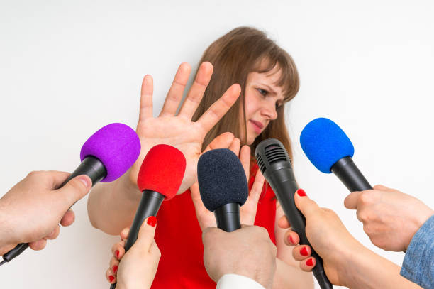 istock Reporters making interview with young woman 683604380