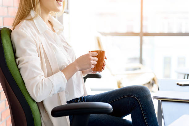 istock Cheerful girl taking pause for hot beverage 683605146