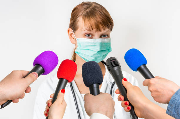 istock Reporters making interview with female doctor 683605410