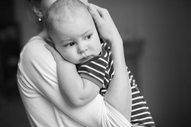 istock Cute boy on mothers hands 683605434