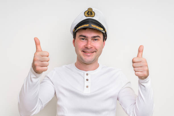 istock Captain with sailor cap showing two thumbs up 683607962