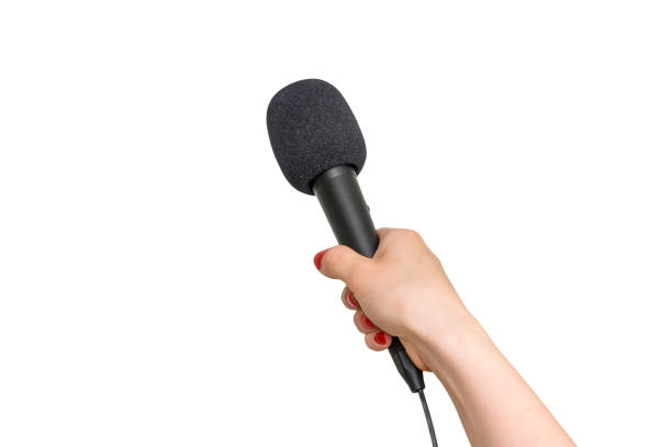 istock Hand of reporter with black microphone isolated on white 683608078
