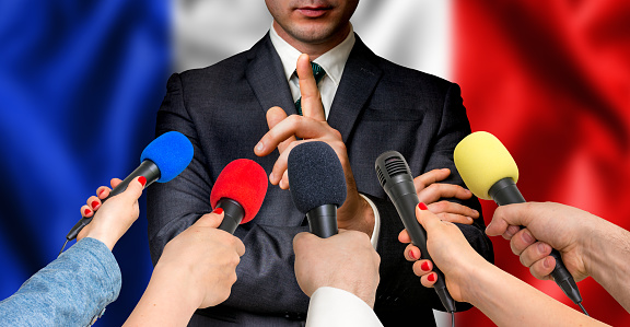 French candidate speaks to reporters. Election in France. Journalism and broadcasting concept.