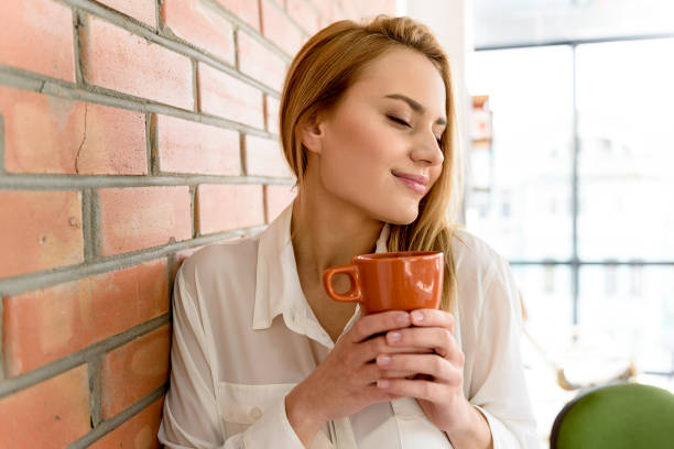 istock Charming lady enjoying aroma coffee 683608174