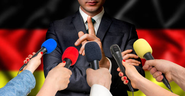 istock German candidate speaks to reporters - journalism concept 683608608