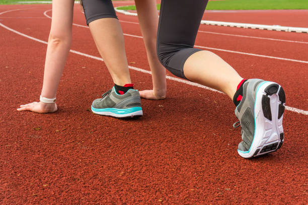 istock Athlete woman at starting line ready to run 683608886