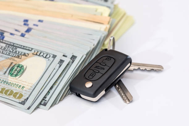 istock car key with us dollar on white backgrounds 683621200