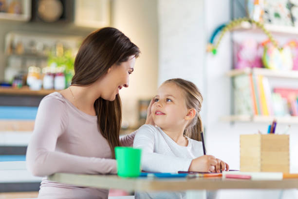 istock Mother and daughter drawing 683624590