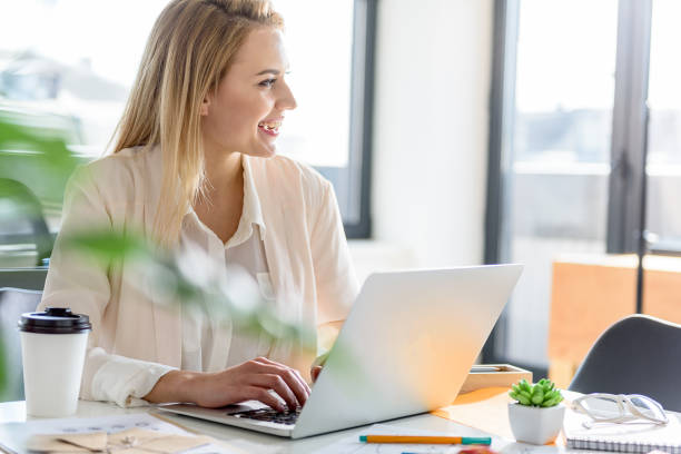 istock Smiling stylish girl working cheerfully at office 683627756