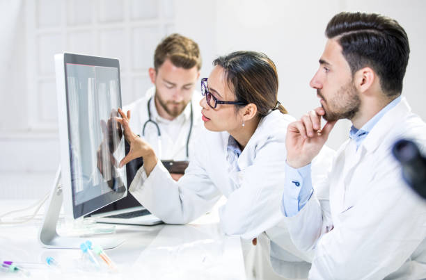 istock Doctors Discussing X-ray images on Computer Monitor 683632540