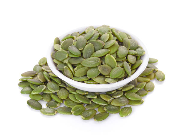 istock pumpkin seeds in white bowl isolated on white background 683638732