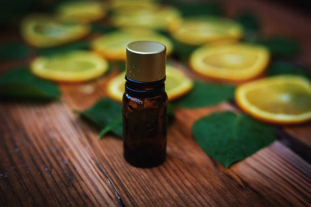 istock orange oil in wooden background 683642102