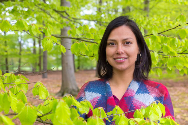 istock Portrait woman with green leaves in spring 683642502